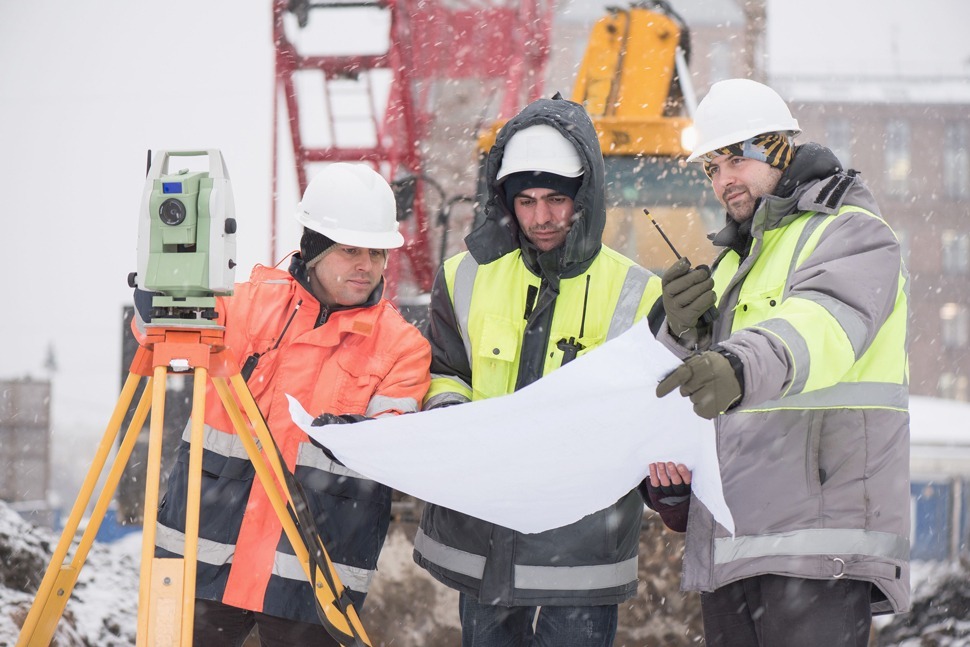 Construction workers in snow