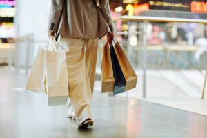 woman with shopping bags during peak season.