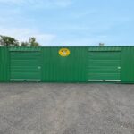 green-40ft-container-with-turbine-vents-and-rollup-doors